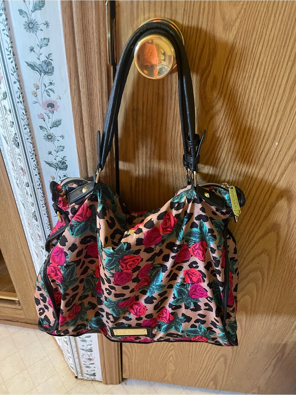 Betsey Johnson Rose print tote. Has small hole that has been sewn